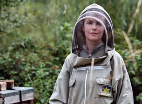 Helen in her bee suit at the apiary.